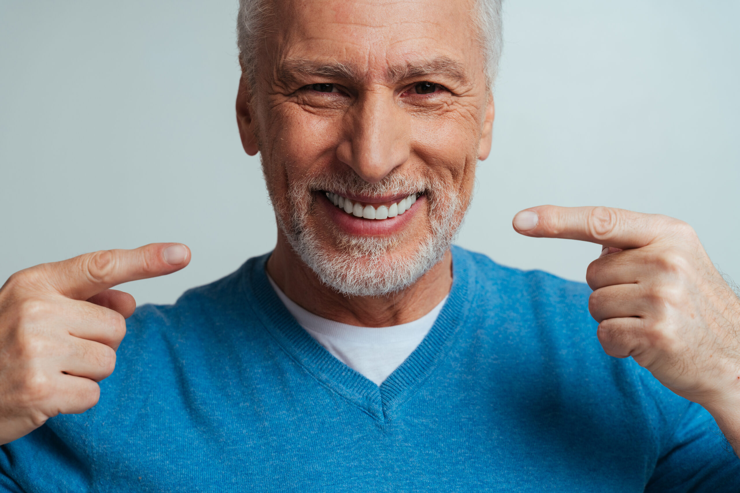 Man smiling wearing dentures